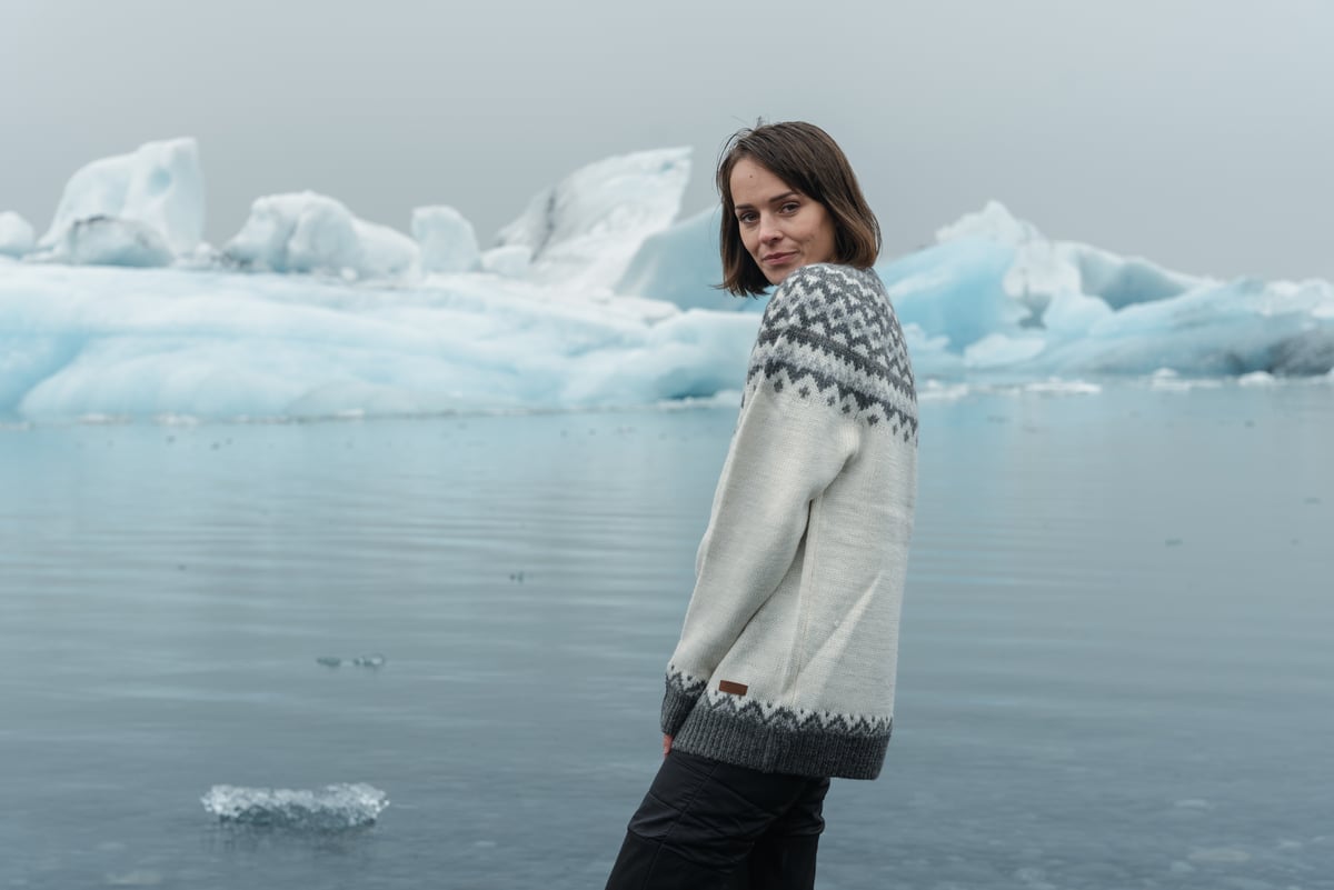 woman next to glacier lagoon