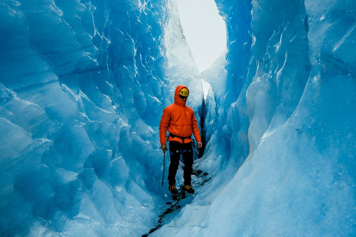 man hiking glacier