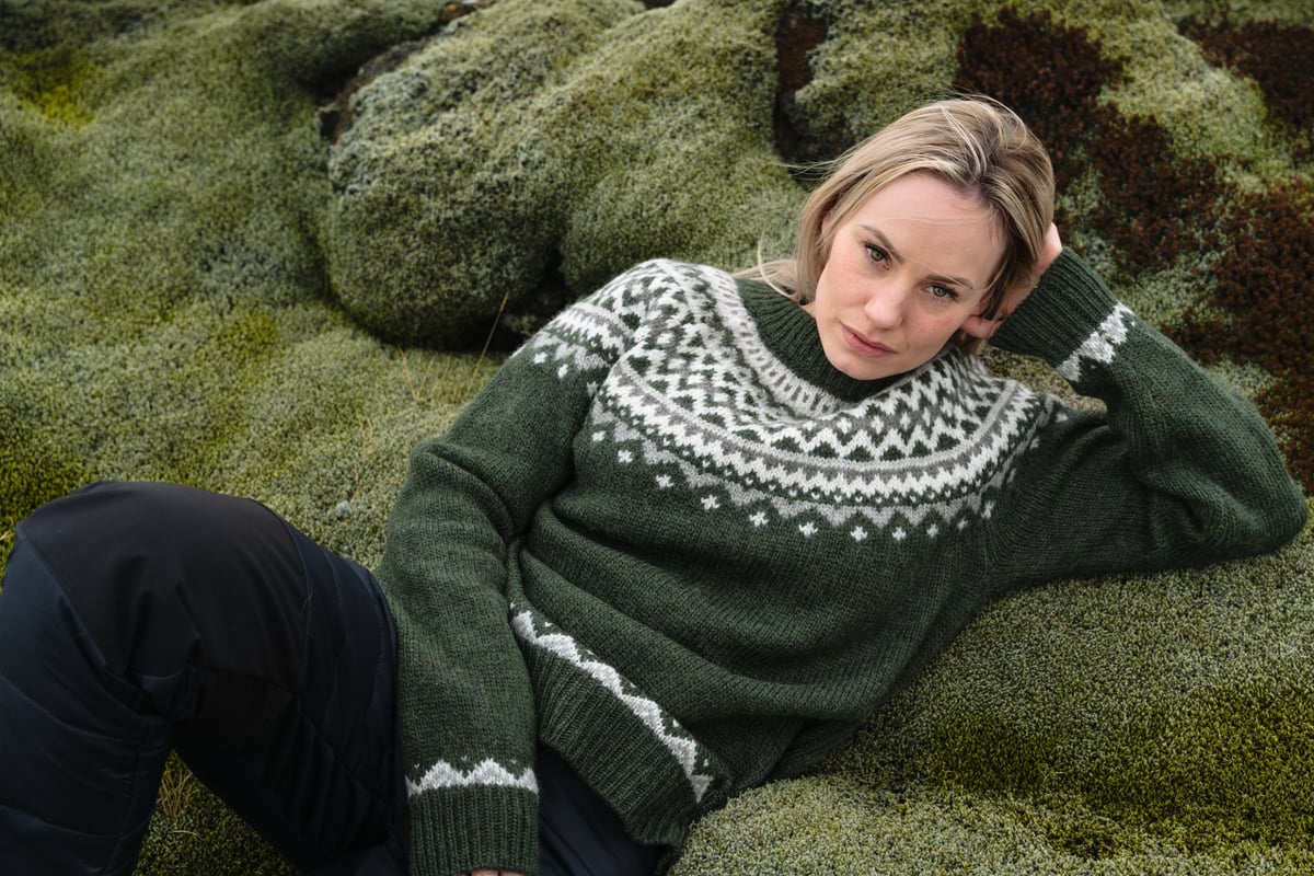 Woman lying in moss