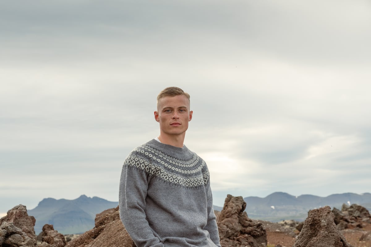 Man sitting on cliff