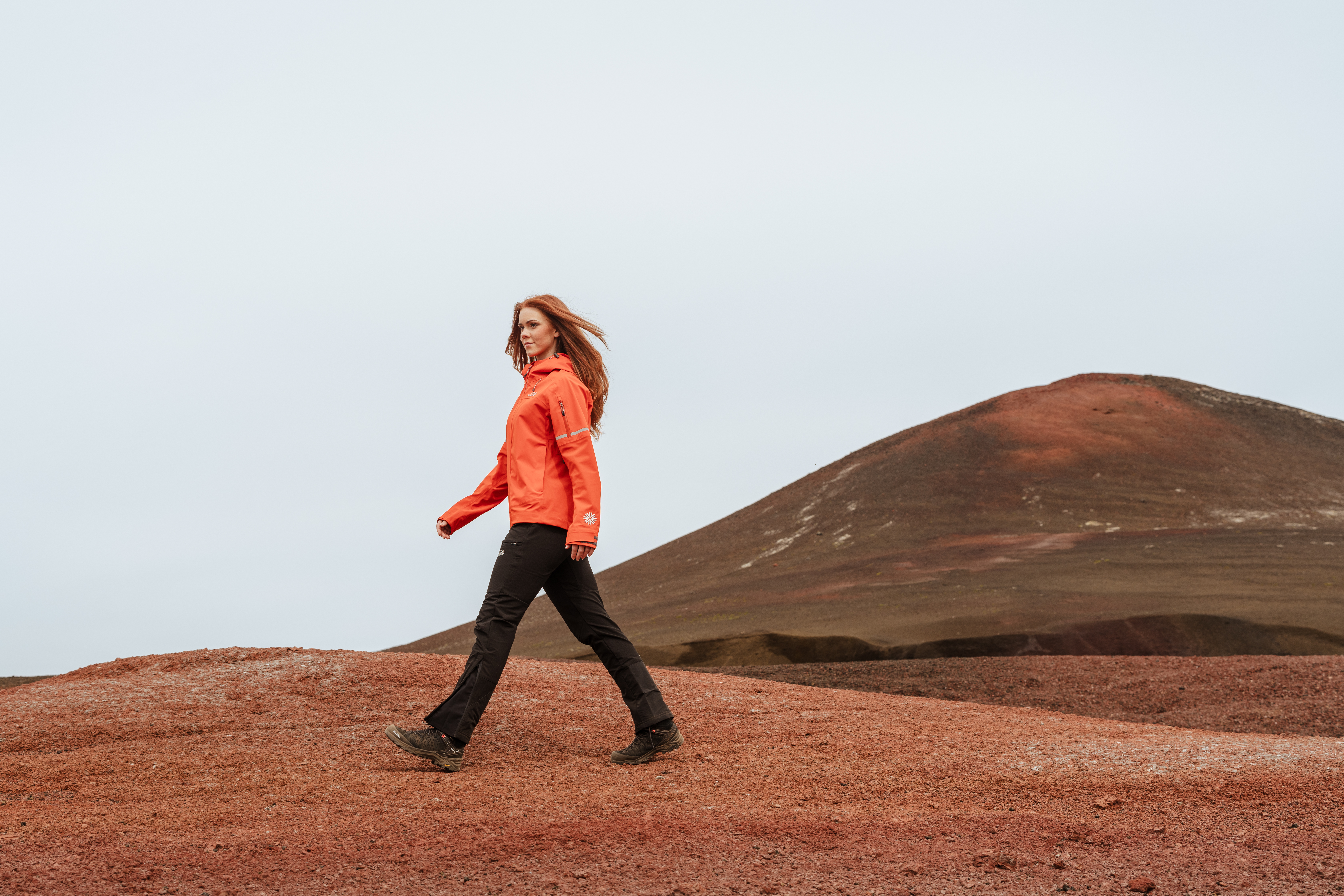 Woman walking in red desert
