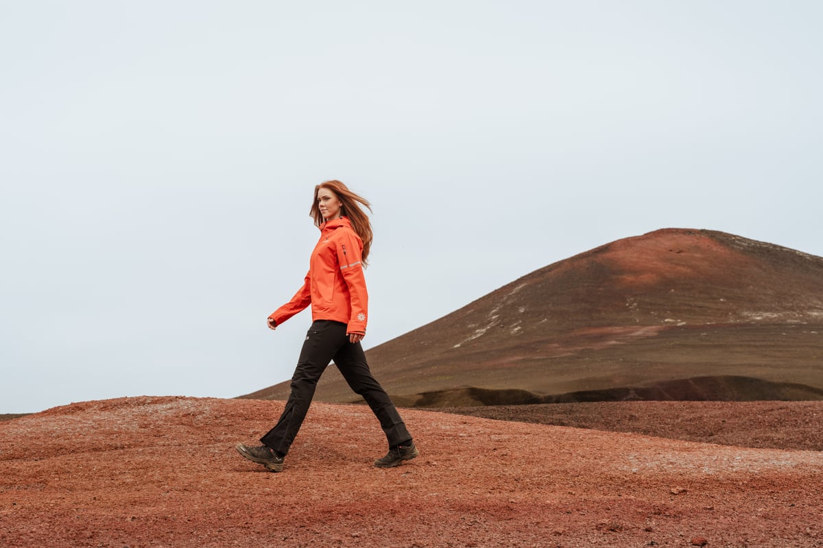 Woman walking in red desert