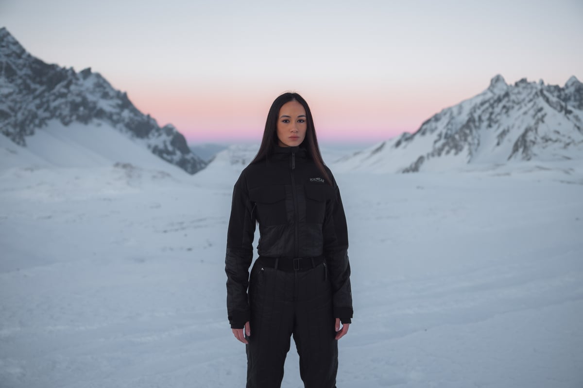 woman hiking in the mountain in the winter time, lot of snow