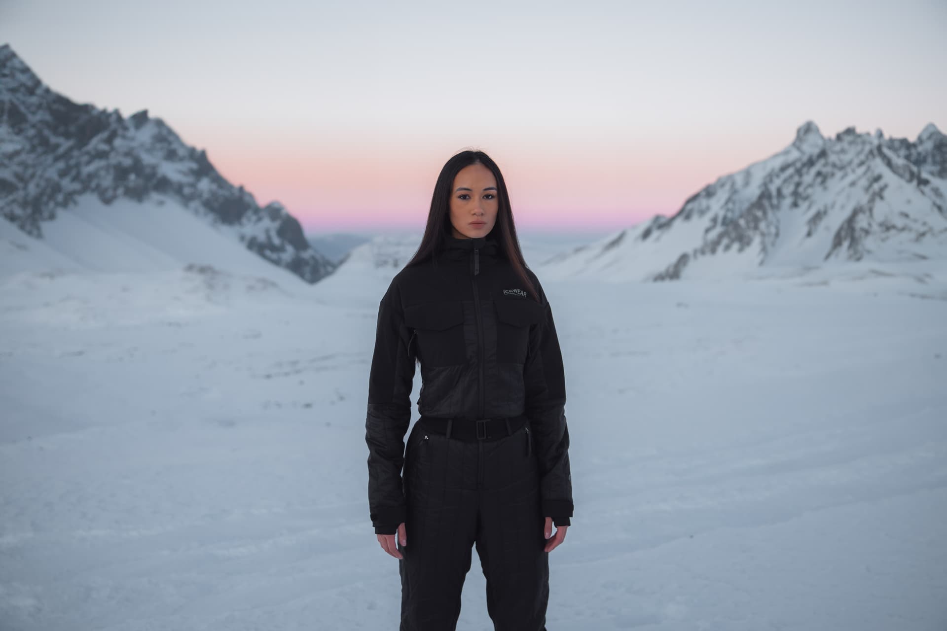 A woman up on a mountain, a lot of snow