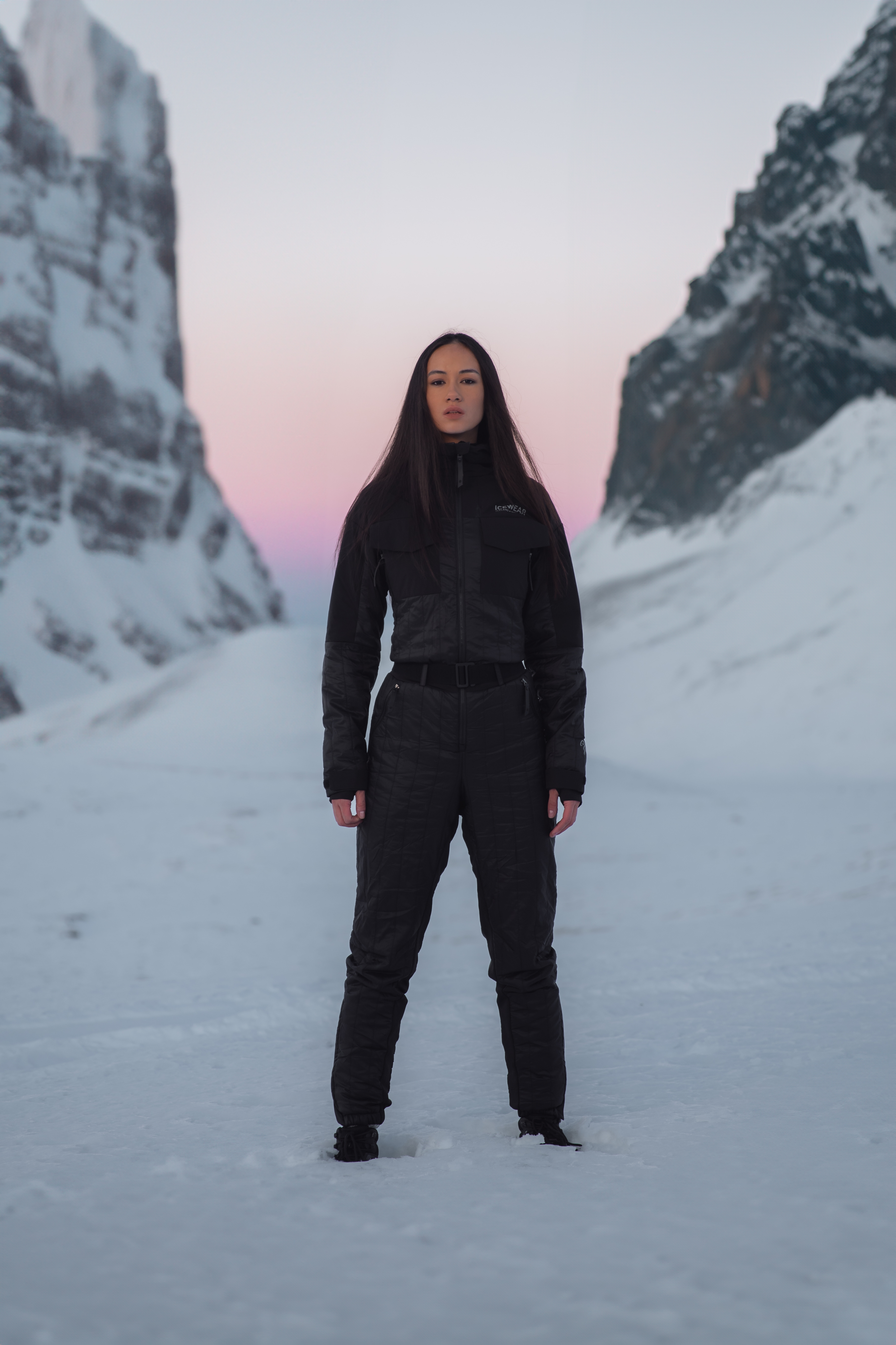 woman up in the mountains with snow