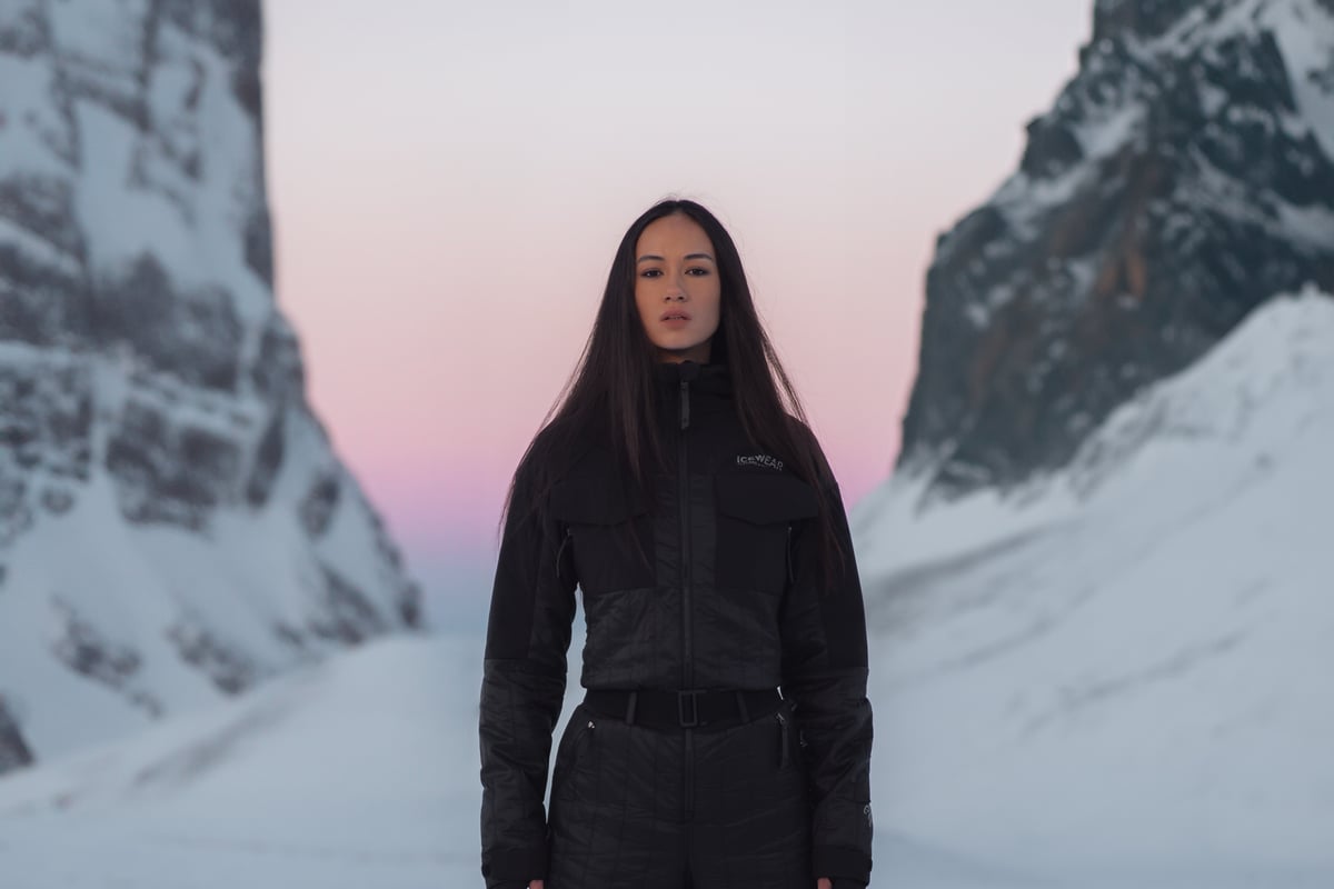 woman up in the mountains with snow