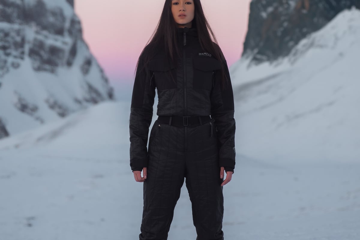 woman up in the mountains with snow