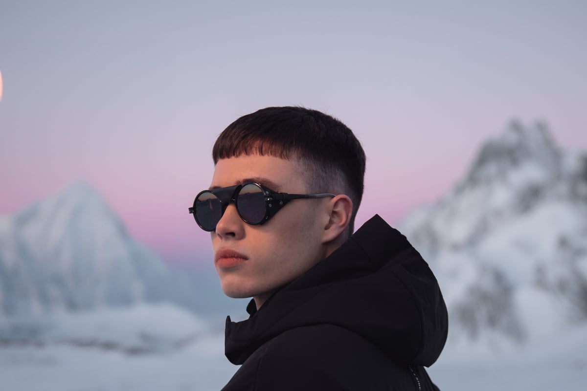 man with sunglasses in mountain, lot of snow