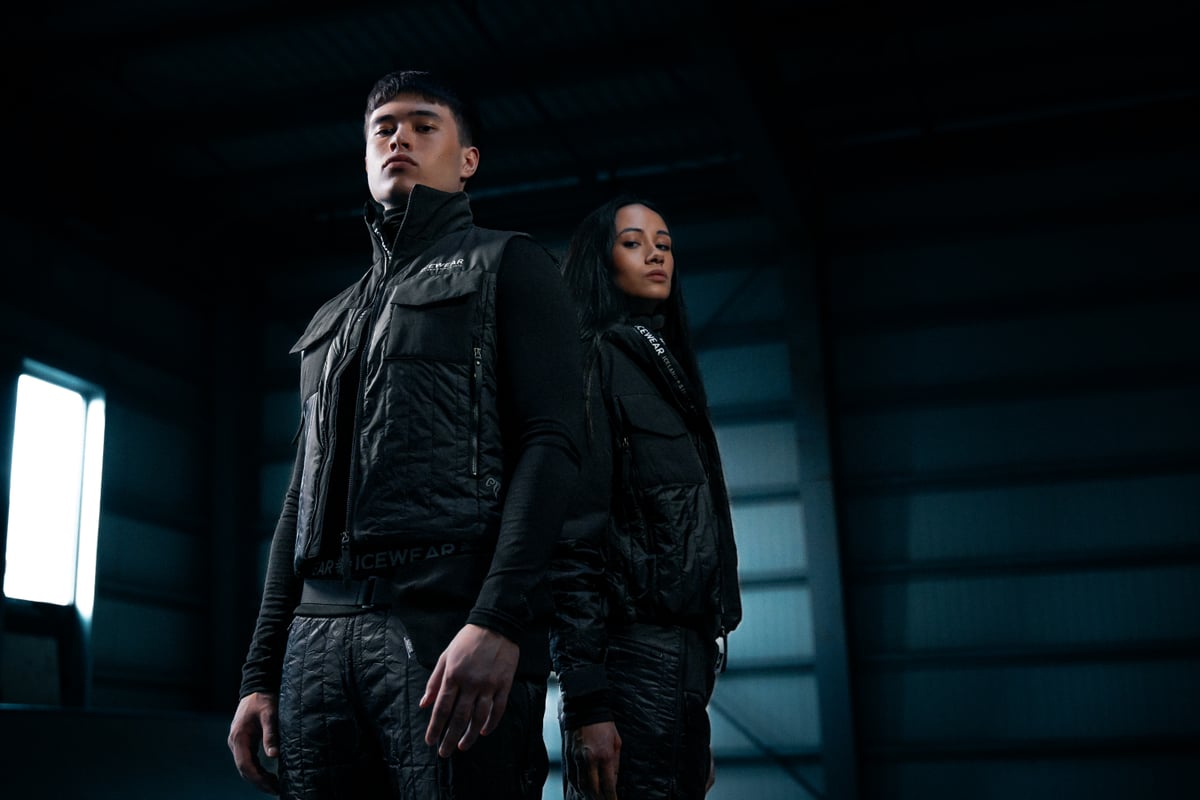 couple in dark warehouse, wearing new Icewear black sheep outfit
