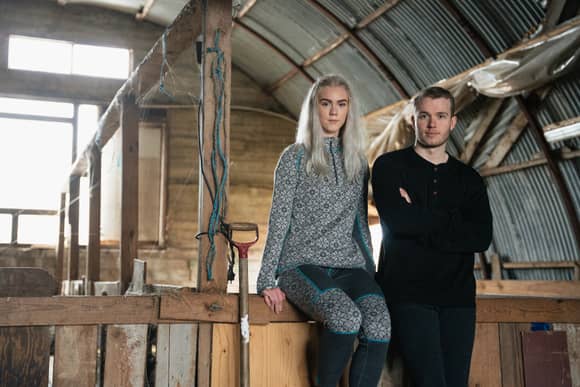 couple on a farm wearing base layers