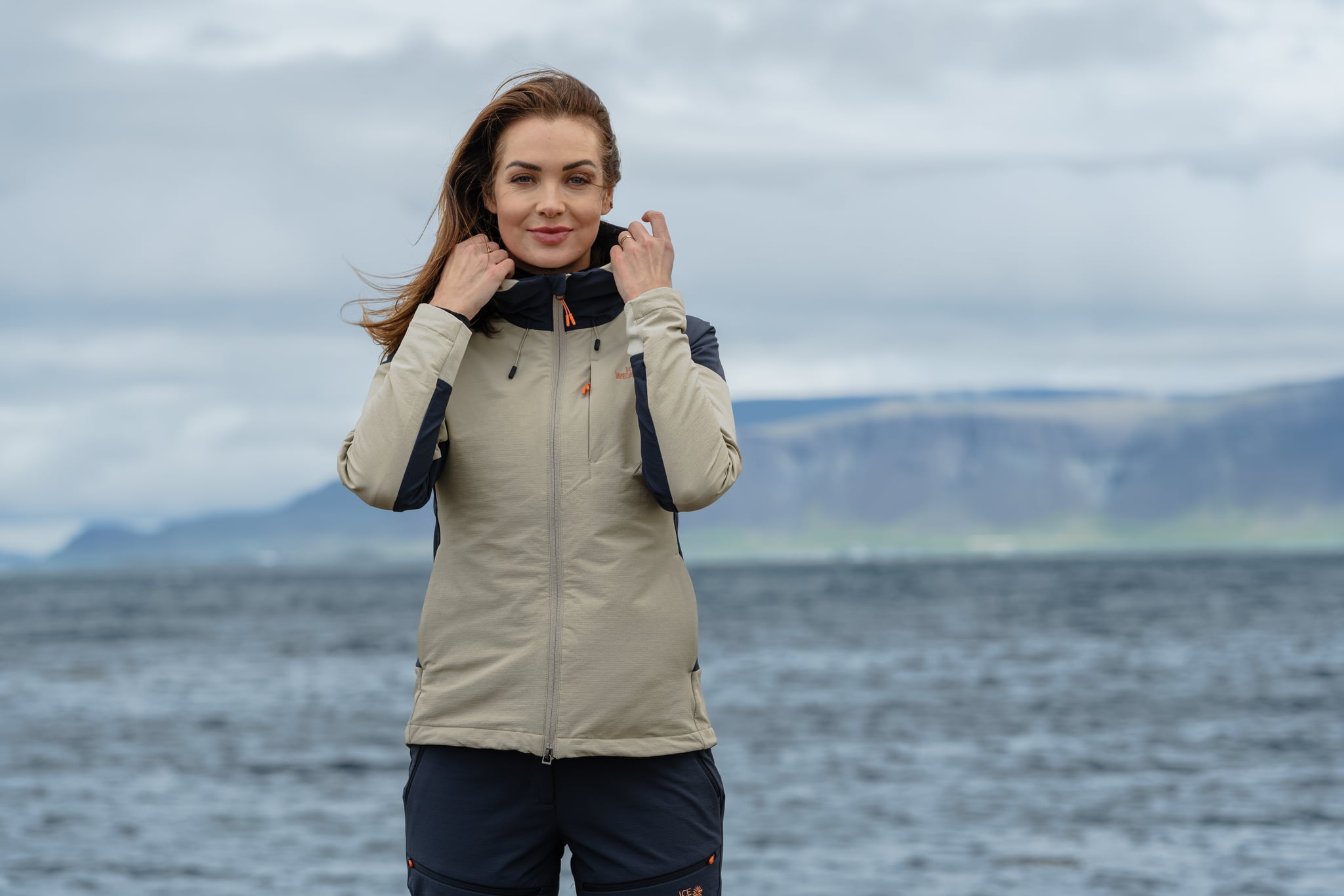 woman-white-blue-jacket-ocean.jpeg
