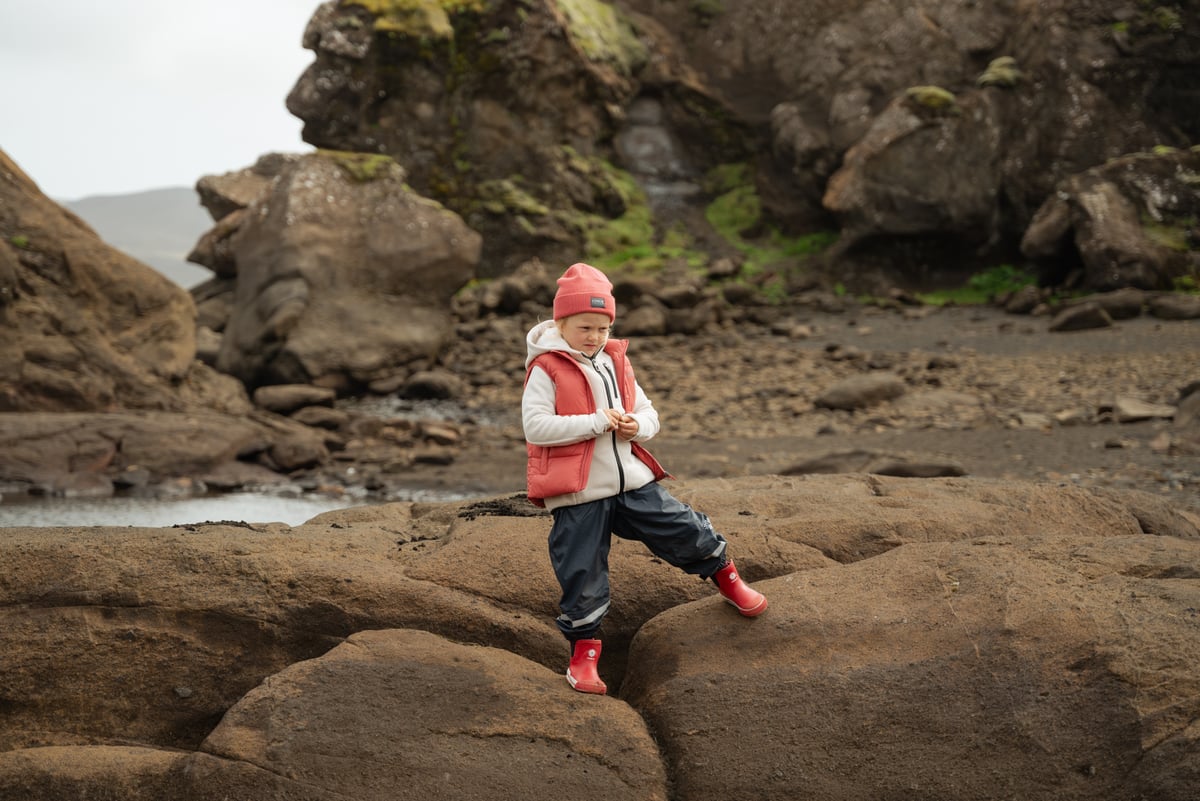 Boy standing on a cliff