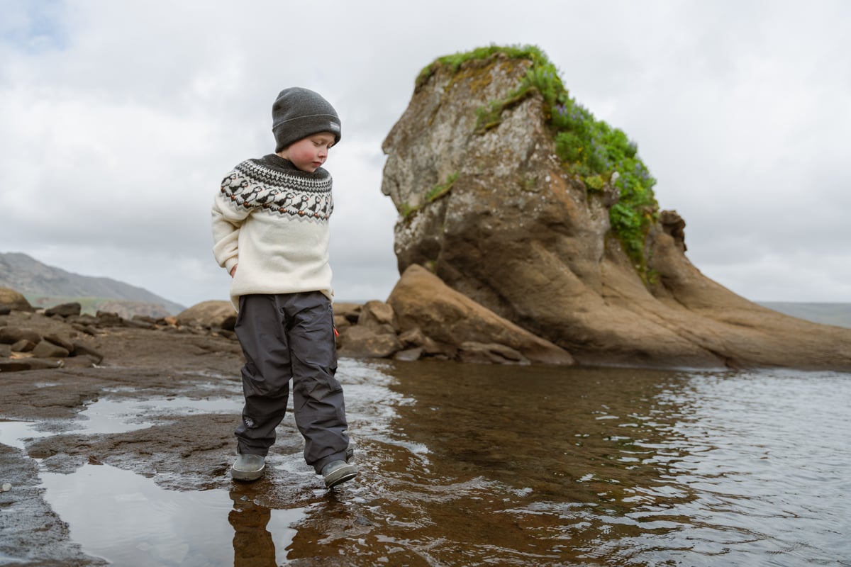 boy walking in water