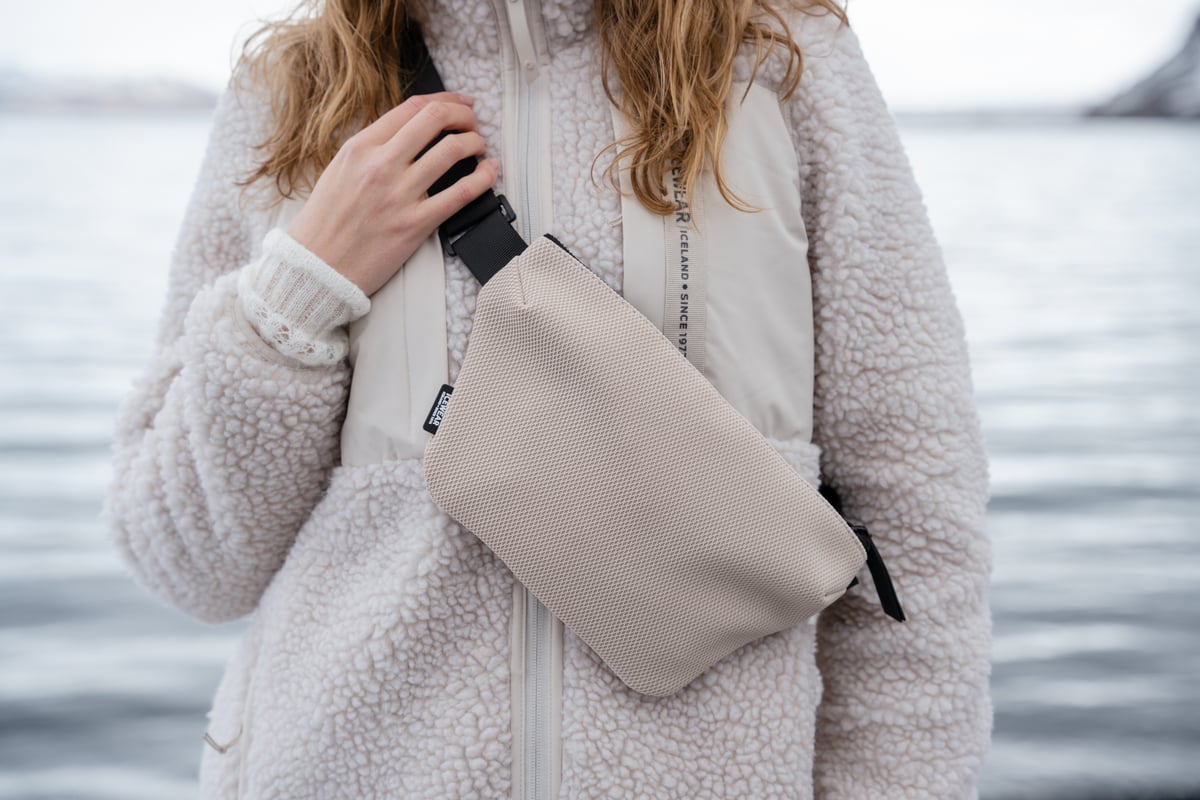 iceland-woman-bumbag-white-sherpa-coat-13.jpeg