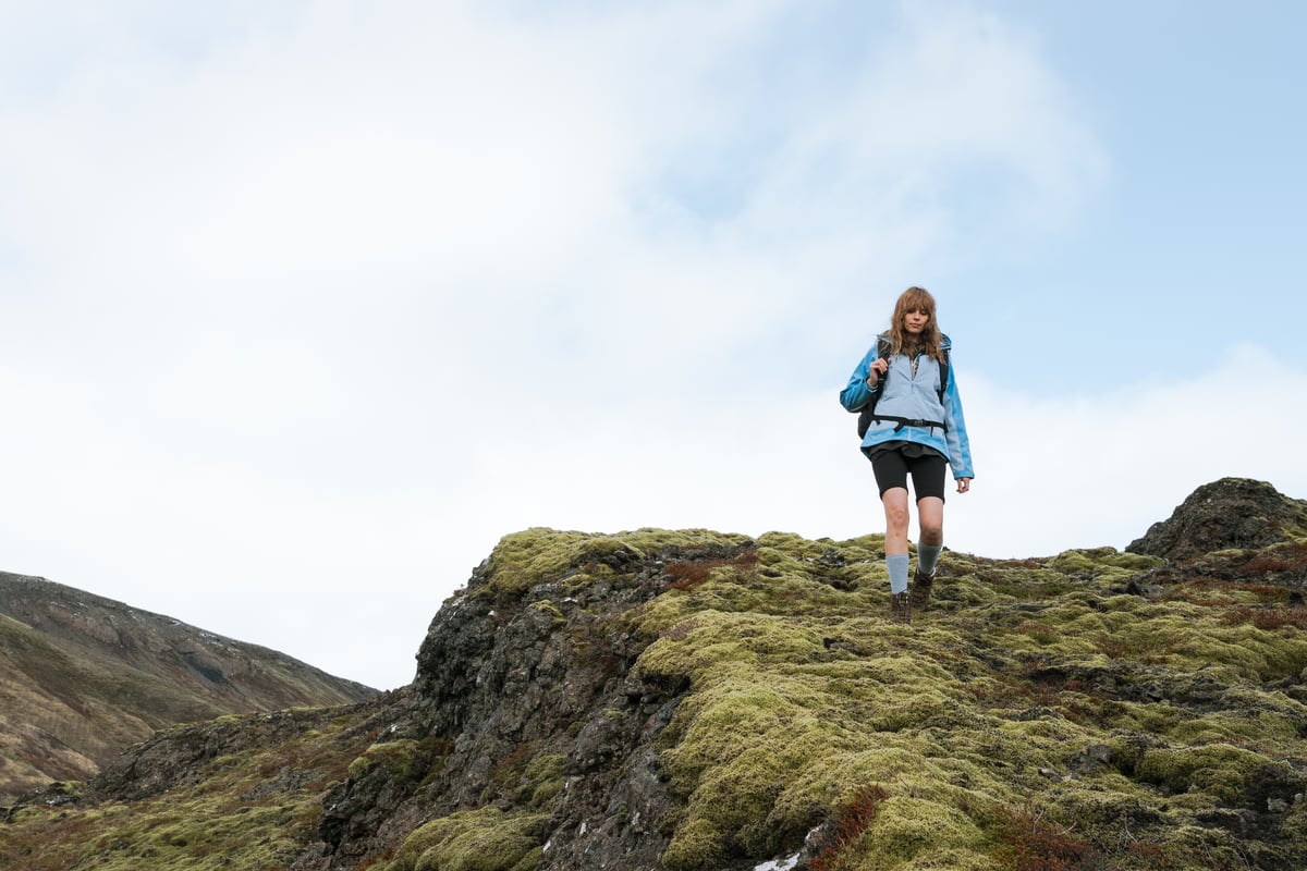 woman hiking down the mountain