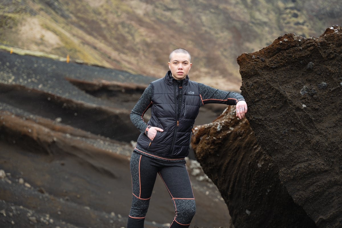 woman next to big rock