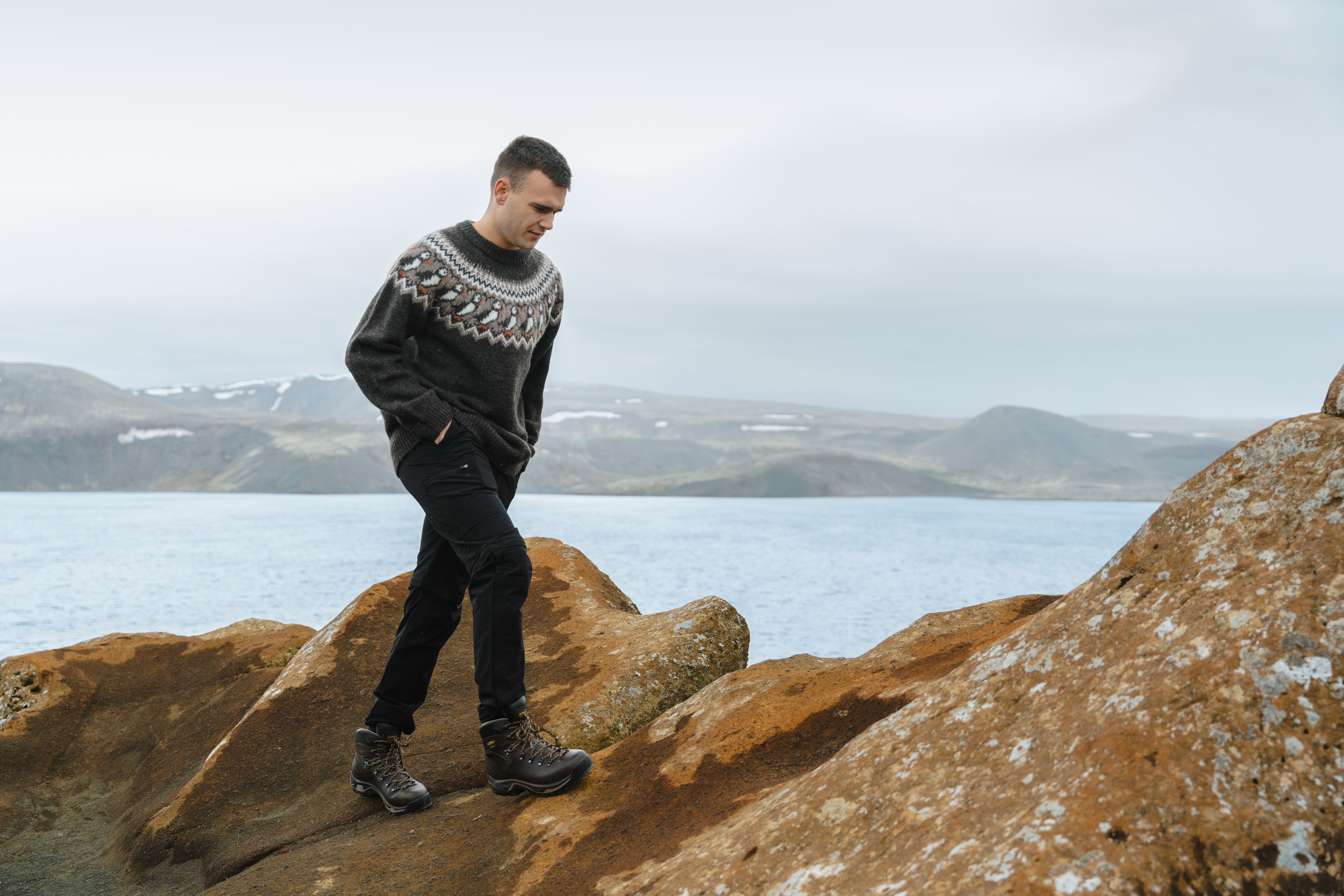 man hiking on cliff