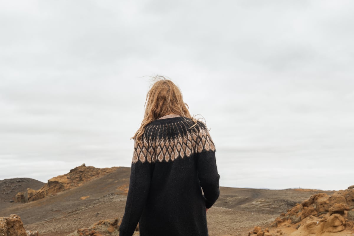 woman walking in rocky nature
