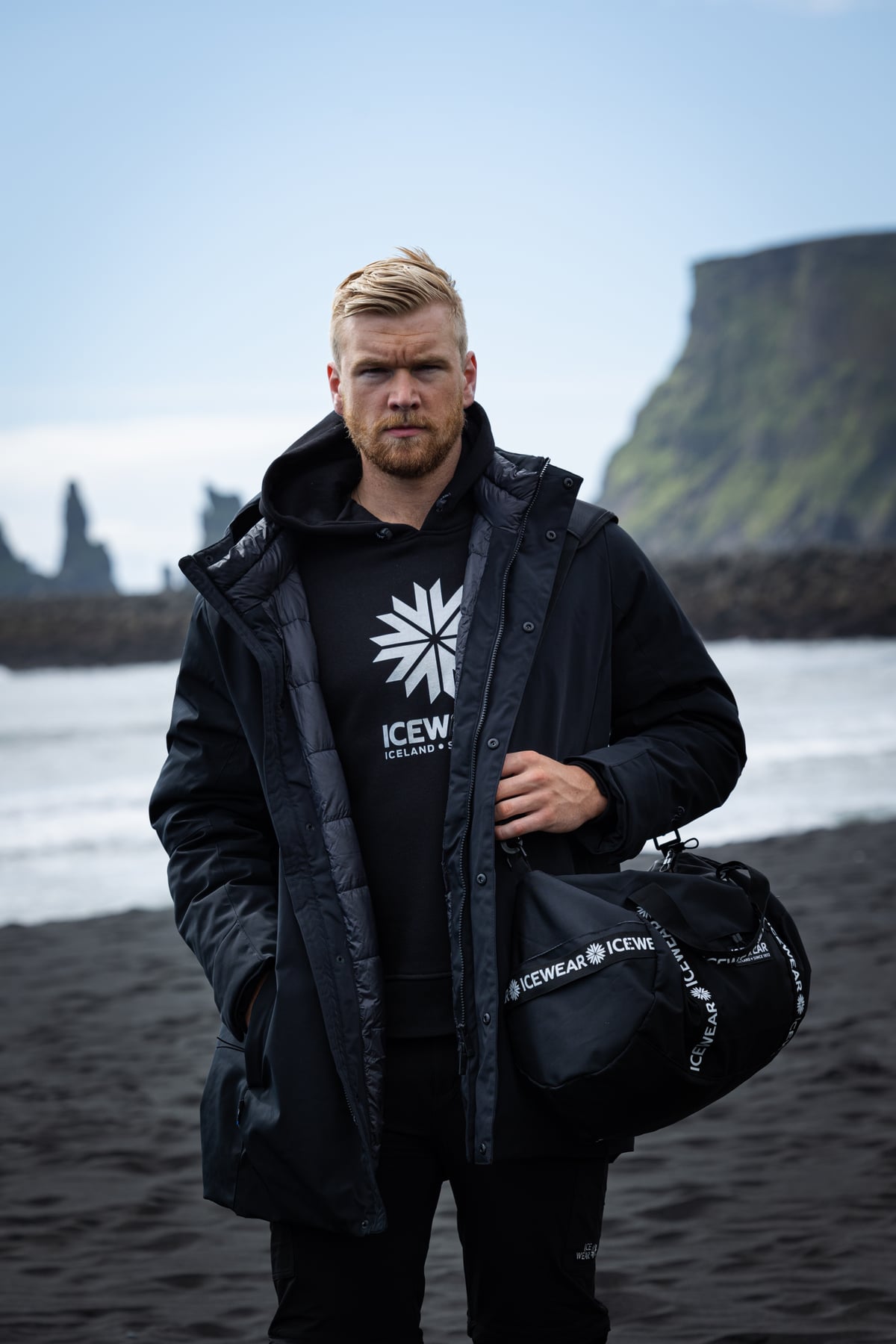 man-black-bag-winterjacket-hoodie.jpeg