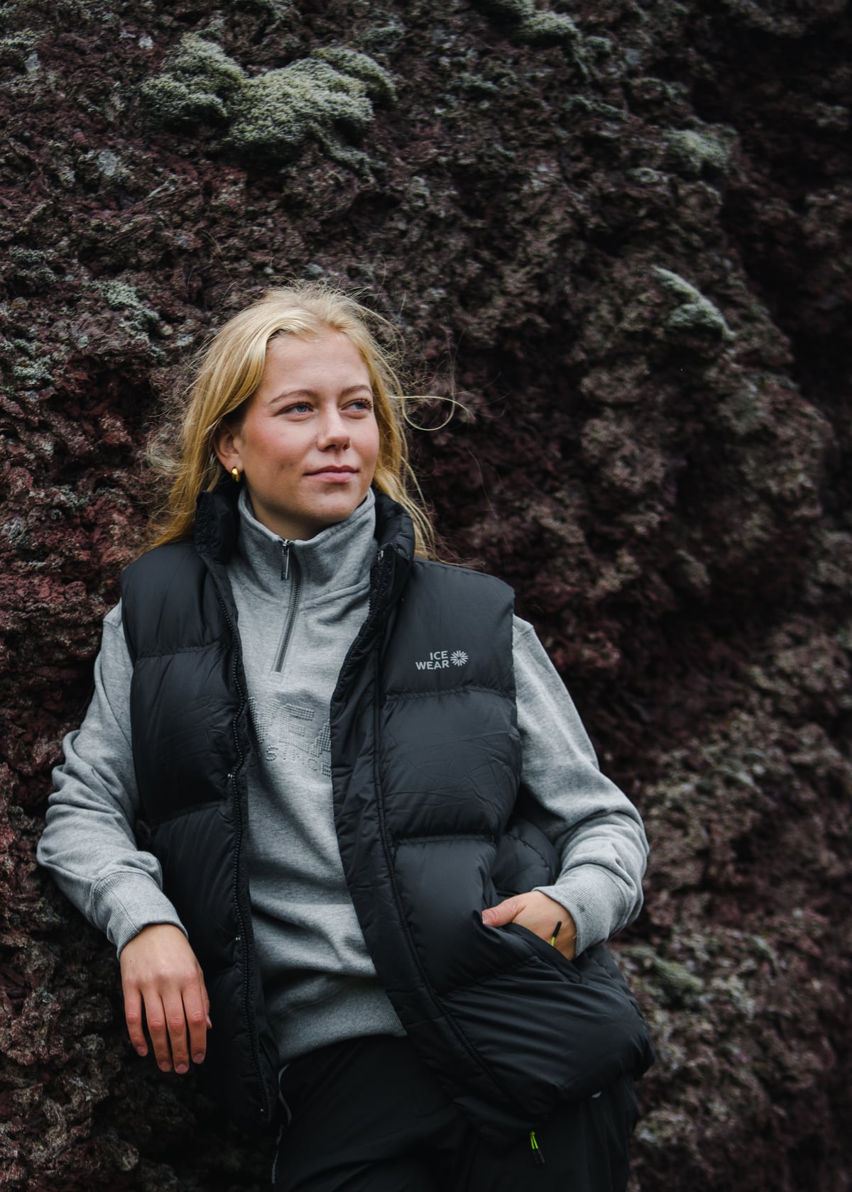 woman-black-downvest-pants-grey-sweater-5.jpeg