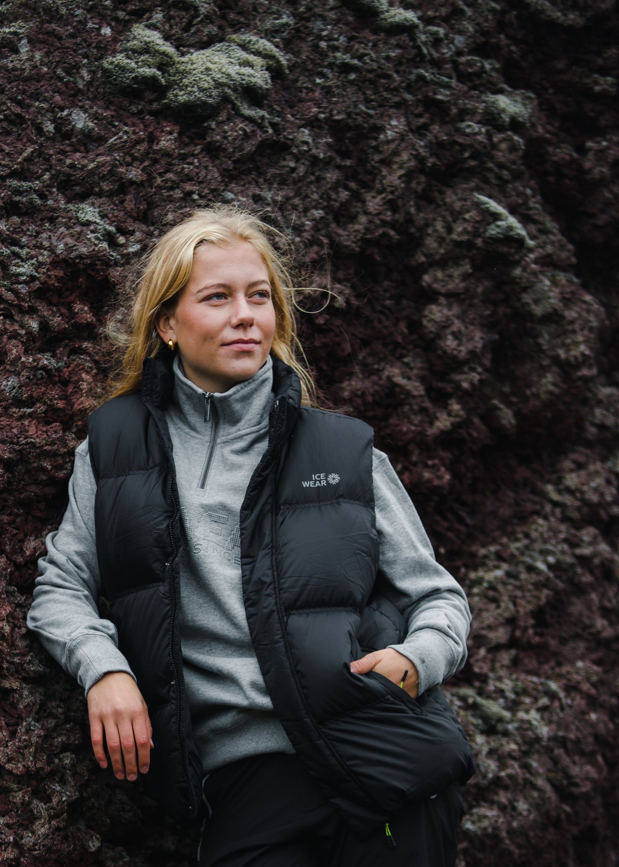 woman-black-downvest-pants-grey-sweater-5.jpeg