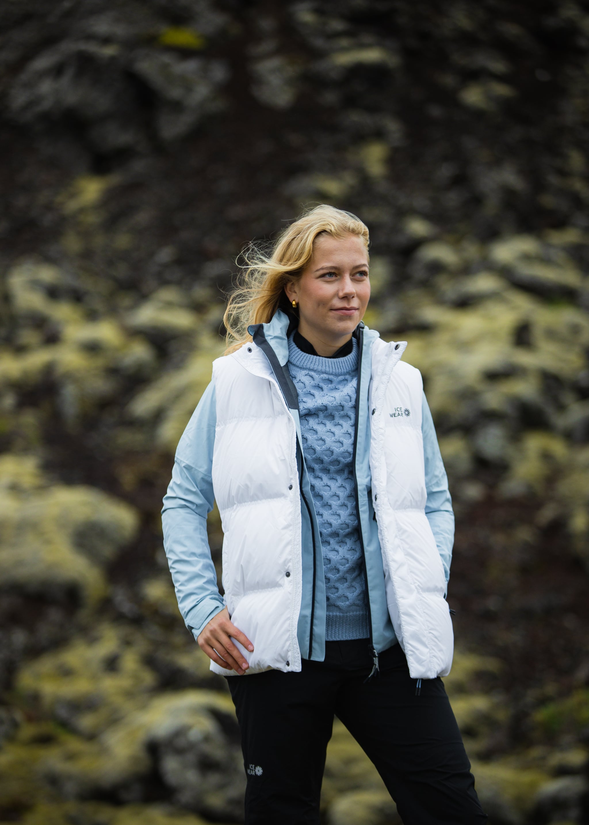 woman-white-downvest-sweater-pants-3.jpeg