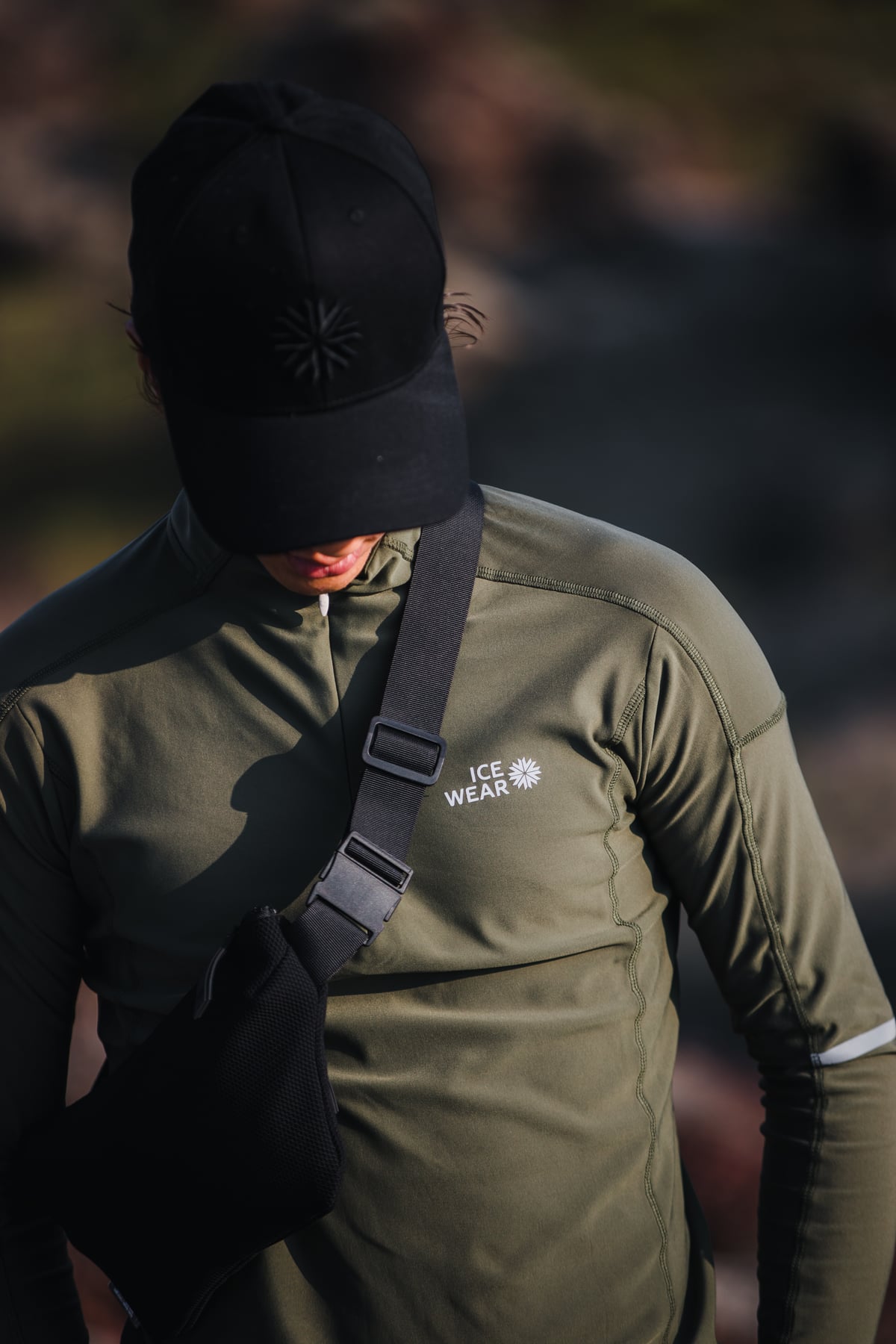 man-green-sweater-bag-cap.jpeg