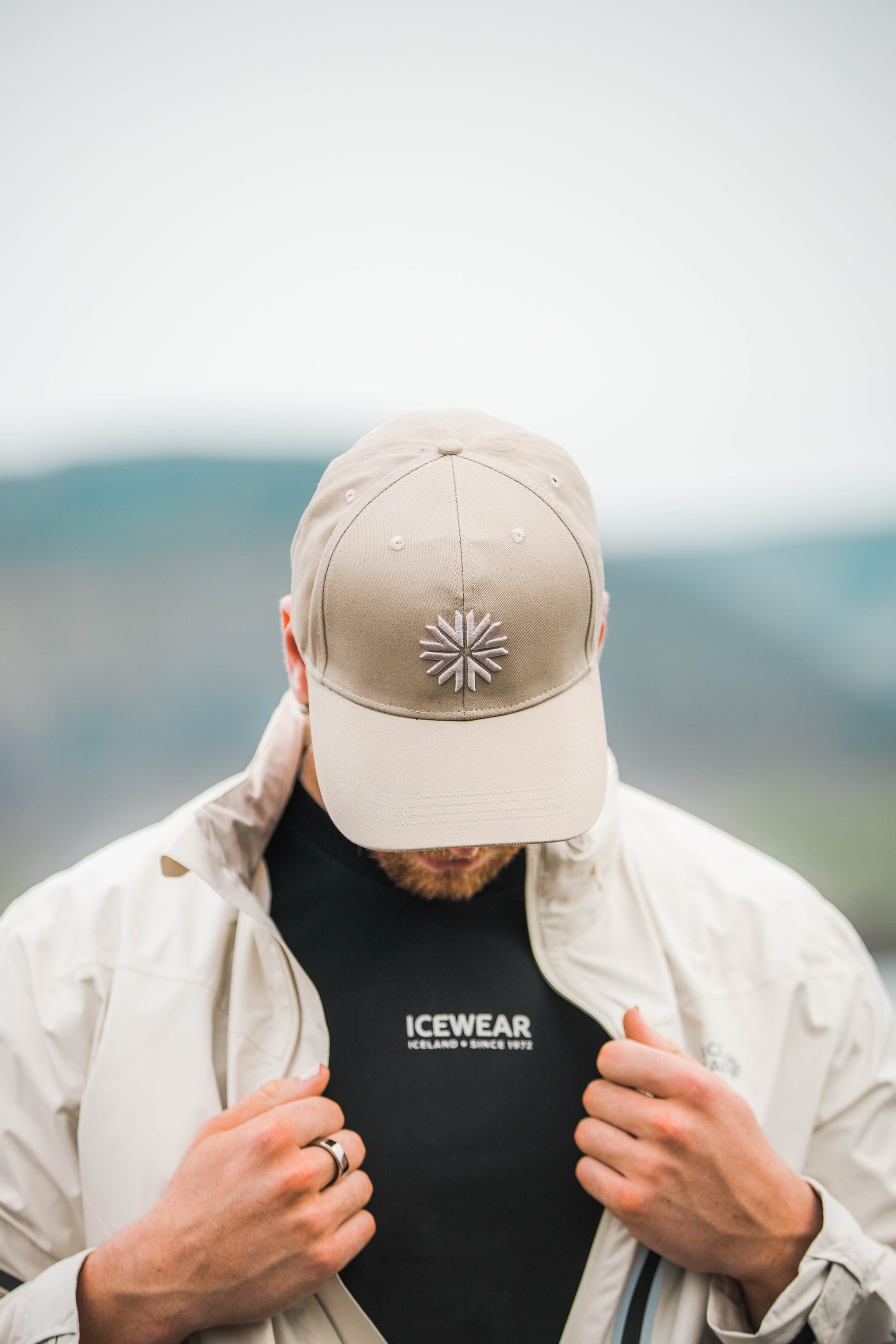 man-white-jacket-cap-shirt.jpeg