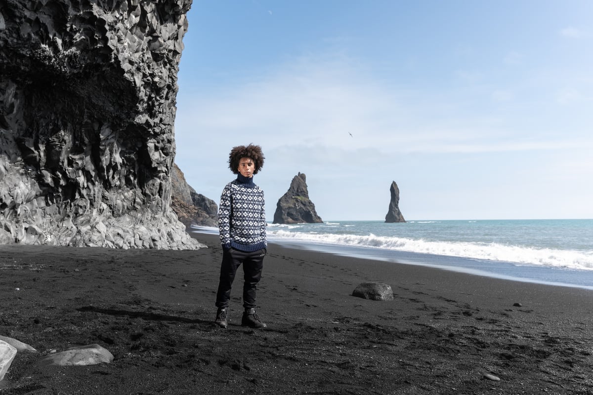Man on Black beach in south Iceland